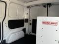 Interior of a 2021 Nissan NV200 van featuring grey panels a Weather Guard storage box and a black floor