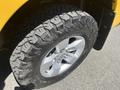 Close-up of a tire on a 2015 RAM 1500 showing the tread pattern and chrome alloy wheel