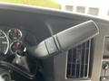 The image shows the gear shift lever of a 2019 Chevrolet Express with buttons for increasing and decreasing gear settings