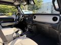 Interior of a 2021 Jeep Gladiator featuring a modern dashboard leather seats and a central infotainment screen
