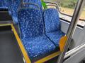 Two blue patterned bus seats inside a 2018 Grande West Vicinity with a focus on the fabric design and seat structure