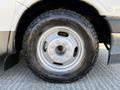 Close-up of a tire from a 2017 Chevrolet Express showing the tread pattern and metallic wheel rim