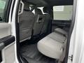 Interior view of a 2017 Ford F-150 showing the rear seats and floor mat in a gray fabric pattern