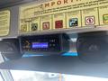 A dashboard of a 2012 Ford Econoline featuring a car stereo and two speakers mounted on the front panel