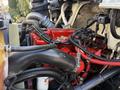 A close-up view of the engine compartment of a 2017 International 4300 featuring visible red and black hoses wiring and engine components