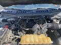 The image shows the engine bay of a 2017 Ford F-150 with visible components including the engine block battery and radiator reservoir