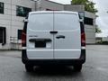 A 2023 Mercedes-Benz Metris van viewed from the rear with a white exterior and no visible license plate