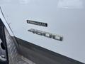 A 2018 Chevrolet Express van displaying the Stabilitrak and 4500 badges on its side panel