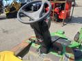 The image shows the steering wheel and control panel of a 2012 John Deere 1445 Series II 4WD lawn mower without any additional context or details