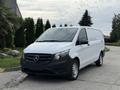 A 2019 Mercedes-Benz Metris van with a white body and black front end parked on a concrete surface