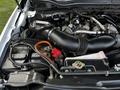 Close-up of the engine compartment of a 2017 Ford F-550 showing the air intake system and various components including the battery and coolant reservoir