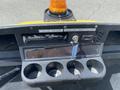 Dashboard of a 1999 Ez-go Industrial cart featuring a yellow light on top a key ignition and cup holders