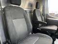 Two front seats of a 2020 Ford Transit van with fabric upholstery and headrests