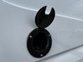 Fuel cap of a 2017 Mercedes-Benz Sprinter with a hinged cover opened revealing the fuel filler neck