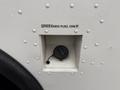 A fuel access compartment on a 2012 Ford Econoline with a cap labeled unleaded fuel only