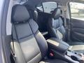 Interior view of a 2017 Acura TLX showcasing black leather seats and a center console