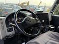 Interior view of a 2013 International Durastar 4300 showing the steering wheel dashboard and controls