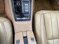 The interior of a 1970 Chevrolet Corvette featuring a beige console with gear shift and control panel