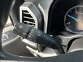 Black control stalk in a 2021 Ford F-550 interior with light and wiper settings and a speedometer in the background