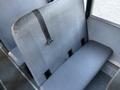A gray bench seat with a black safety strap designed for a 2014 International 4300 truck interior