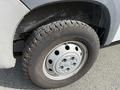 A close-up of a 2017 RAM Promaster wheel showing a silver steel rim and a durable tire with a rugged tread pattern