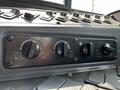 Close-up of the control panel of a 2022 Blue Bird BB Conventional featuring knobs for air conditioning settings and fan controls
