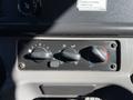Control panel of a 2017 Freightliner M2 106 featuring knobs for temperature and airflow settings