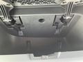 Interior view of a 2022 Freightliner Cascadia dashboard with storage compartment and mounting clips for components