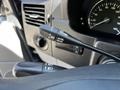 Close-up of the control stalk for cruise control in a 2017 Mercedes-Benz Sprinter showing buttons for resume set accelerate and decelerate