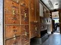 Wooden storage cabinets with multiple drawers and brass handles inside a 2009 Morgan Olson Workhorse vehicle
