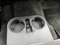 A console with two cup holders in a 2016 Ford F-150 interior