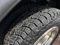 Close-up of a rugged tire from a 2017 Ford Econoline showcasing its deep treads and textured surface for enhanced traction