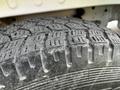 Close-up of a textured tire on a 2017 Mercedes-Benz Sprinter showcasing tread patterns and surface details
