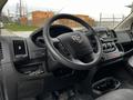 Interior view of a 2018 RAM Promaster featuring a steering wheel dashboard controls and gear shift console