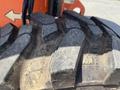 Close-up of a worn tire from a 2008 JLG Boom Lift with distinct tread patterns and dirt buildup visible on the surface