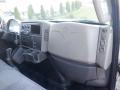 Interior view of a 2014 International Durastar featuring a dashboard with controls a display screen and air vents