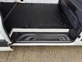 Interior view of a 2019 Mercedes-Benz Sprinter showing the cargo area floor and side step highlighted by black rubber covering