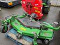 2014 John Deere 1585 Terrain Cut mower with a green cutting deck and multiple wheels positioned on a blue pallet