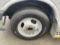 Close-up of a 2017 Chevrolet Express wheel with a Michelin Agilis tire showing multiple lug nuts and a silver rim