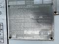 2012 Freightliner M2 106 vehicle with a metal identification and operational instructions plate attached