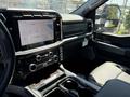 Interior of a 2024 Ford F-550 Super Duty featuring a large touchscreen display and modern dashboard controls