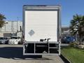 A 2017 Freightliner M2 106 truck viewed from the rear with a white cargo box and a hitch attachment visible beneath the rear bumper