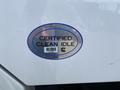 White label on a truck displaying the text CERTIFIED CLEAN IDLE with a barcode and a circular Cummins logo