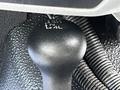 The gear shift lever of a 2016 Ford F-550 showing settings for 2H 4H N and 4L