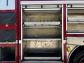 A 2006 Emergency One Fire Truck with open storage compartments showing metal shelves and a non-slip bottom surface
