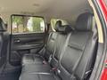 A 2016 Mitsubishi Outlander featuring black leather seats in the rear row with a spacious layout designed for comfort and utility