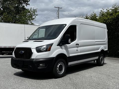 A white 2022 Ford Transit van with a sliding side door and black trim parked on a paved surface