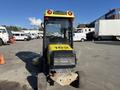 A yellow and black 2010 Kubota F3990 with a cabin and two red lights on top facing the viewer