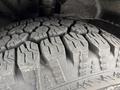 Close-up of a heavily treaded tire from a 2022 Ford Transit showcasing deep grooves designed for traction and grip