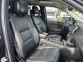 Interior of a 2015 Dodge Durango showcasing black leather front seats and a central console